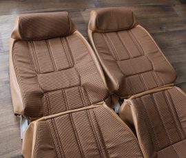 New Seat Skins/Covers/Trims made with FORD XC Houndstooth Seat cloth fabric "ginger" Falcon 500 HARDTOP V8 Fairmont GS Rally Pack Coupe material, and Novatex Vinyl "Ocher". Also available in other cloth colours like "Dusk", "Doeskin" cloth and vinyl colours like black, cream, camel etc. Can also make Cobra style seats with blue and black cloth fabric as per factory original.